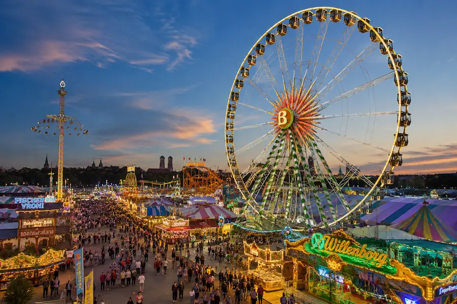 Ferris wheel and fairground attractions at Munich Frühlingsfest